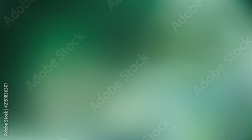 Emerald green abstract background, soft blurred gradient texture, dark forest green bokeh backdrop for web design and banners