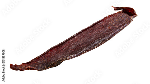 Фотография Thin strip of dried beef jerky with dark red color and textured surface
