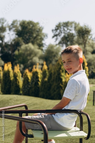 Happy Boy Playing on Modern Playground