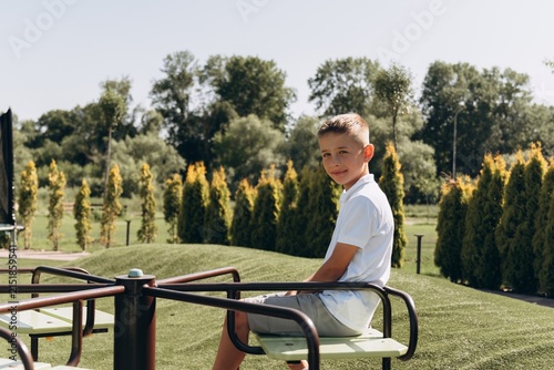 Happy Boy Playing on Modern Playground