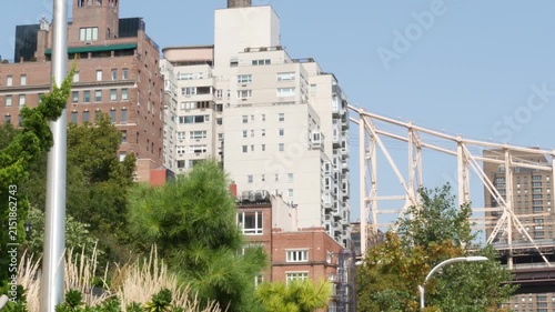 New York City Manhattan Midtown, Queensboro bridge architecture in United States. Urban transport bridge. Metallic bridge over East River esplanade in East Side. Urban park near Roosevelt island.