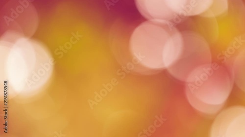 Dreamy pinkish-amber bokeh circles floating in warm dusk breeze, serene natural background