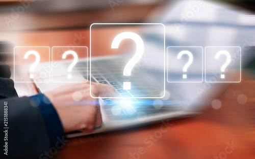 Business professional using a laptop with glowing question marks, representing uncertainty, research, decision making, problem solving, digital questions, information search, strategy, analysis.