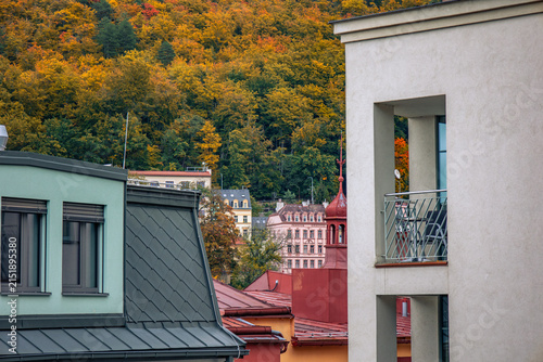 Czech Republic, Karlovy Vary. 10.10.2025. Autumn city rooftops and forested hills in Karlovy Vary