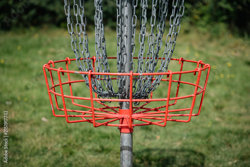 red disc golf basket