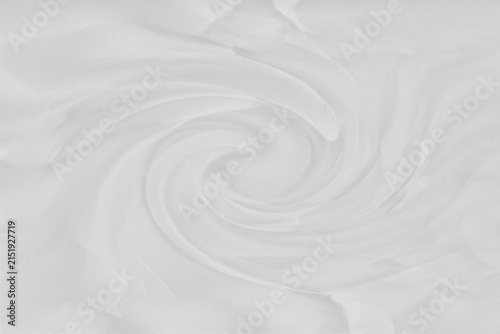 Photography Swirling white cream texture with circular motion and soft shadows, abstract bac