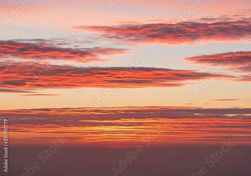 Vibrant Sunset Sky with Fiery Orange and Pink Clouds.