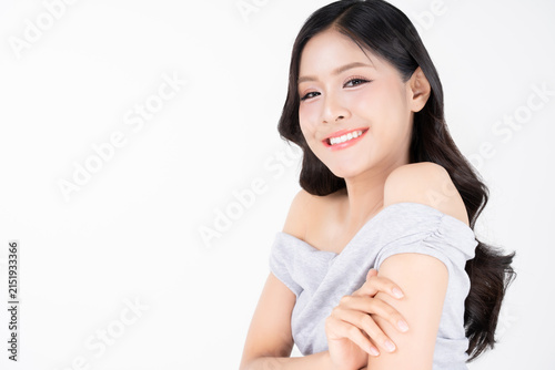 Portrait of beautiful young Asian woman with healthy facial skin and glowing makeup for beauty and cosmetics concept.