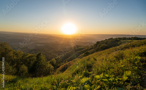 View of the mountains and Kislovodsk from the observation decks of the Kislovodsk Park. Evening sunset over the mountains of Kislovodsk.