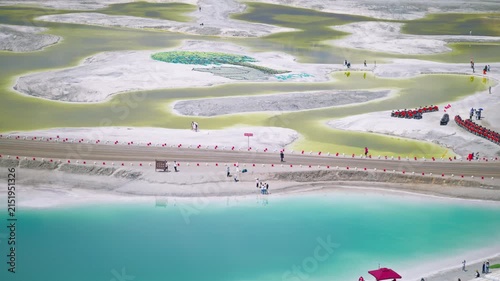 Aerial View of Salt Bridge Causeway in Dachaidan Emerald Lake Core Zone: Green and Blue Mineral Ponds, White Salt Crust in Qinghai