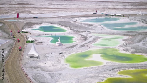 Aerial View of Salt Bridge Causeway in Dachaidan Emerald Lake Core Zone: Green and Blue Mineral Ponds, White Salt Crust in Qinghai