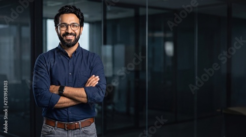 Portrait of happy mature 30 year old professional business owner man manager, smiling senior male ceo executive, middle corporate leader looking at camera standing arms crossed in office at work.
