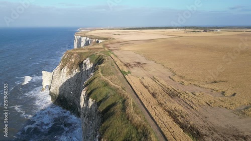 Drone aerial panoramic shot flying left over the edge of dramatic Yorkshire cliffs