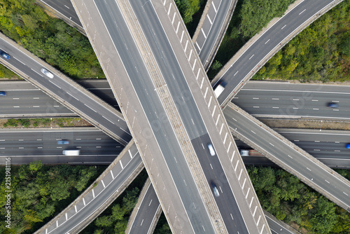 Overhead Aerial View of a Busy Highway Intersection With Cars Driving During Daytime