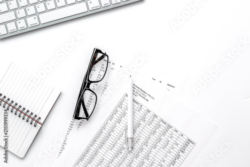 business accounter work with taxes and keyboard on white office desk top view mock up