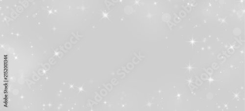 Fotografie Scattered bright white twinkling stars with lens flare effects on deep black bac