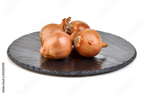 Cuadro en lienzo Fresh Shallots on a Dark Slate Plate