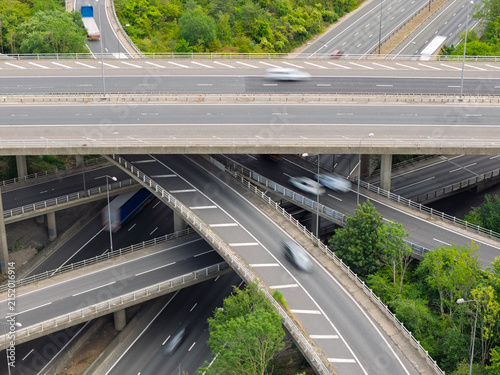 фотографія Vehicles Travel Across a Multilevel Highway Intersection During the Bright Dayti