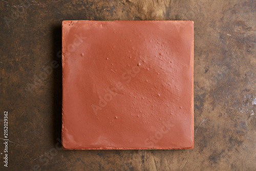 Square Terracotta Clay Tile Top View on Dark Vintage Background