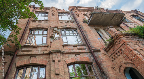 Bild auf Leinwand An old ruined multi-story building from the early 20th century