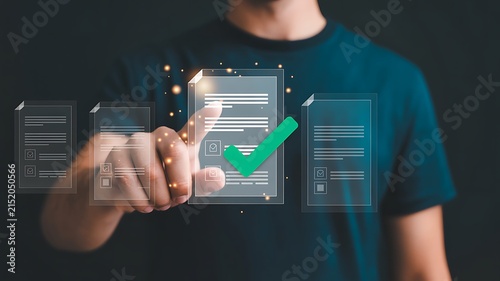 A person is touching a digital document with a checkmark, indicating approval or completion. The document is part of a series of digital files displayed in a modern, technological interface