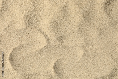 Obraz na płótnie Natural sand texture background, beige sand surface, top view.