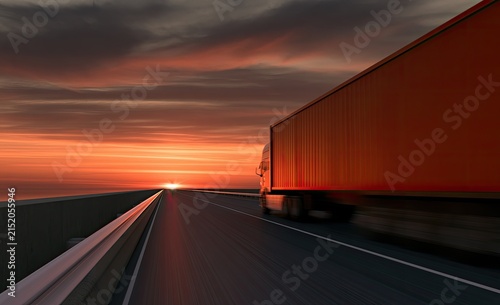 Truck travels on highway at sunset with motion blur