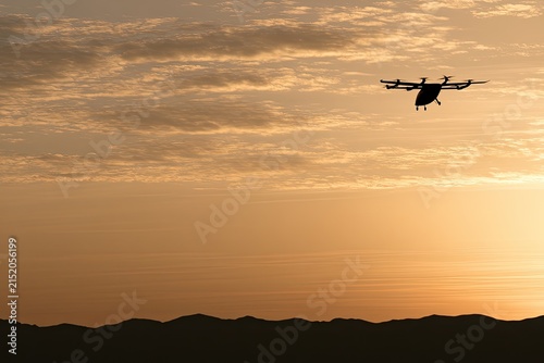 Futuristic aircraft navigates twilight sky over silhouetted mountains