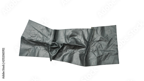 Obraz na plátne A long, folded strip of silver duct tape is laid out diagonally on a white background, showcasing its crinkled texture and adhesive properties