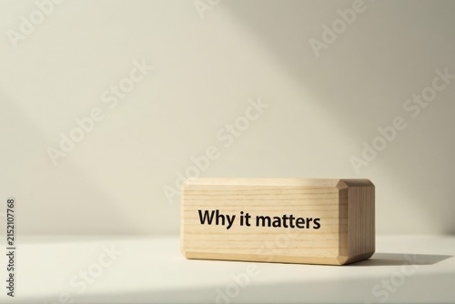 Wooden block with inspirational message of importance and significance on a neutral background, highlighting the concept of purpose and value.