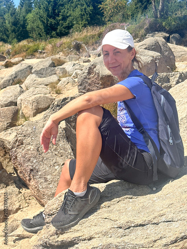 Woman  50 +on a mountain trail

