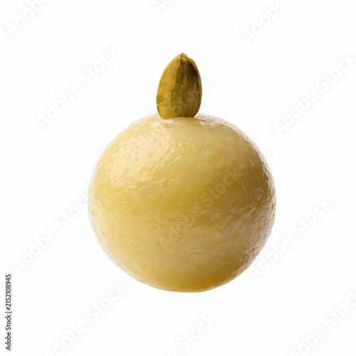 Traditional Indian Peda Sweets Topped with a Pistachio on Pure White Background