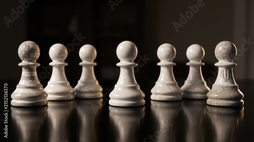 White chess pawns with national flags on dark board with dark reflective surface engraved national displays white international competition