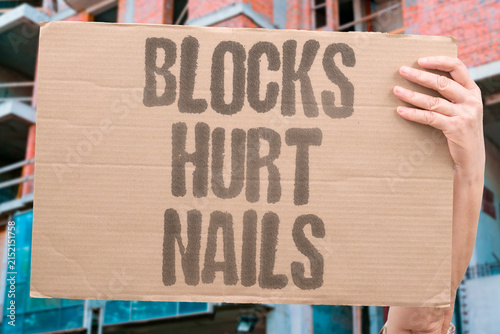 Obraz na plátně "Blocks hurt nails" Separating thin building pieces can injure your fingertips