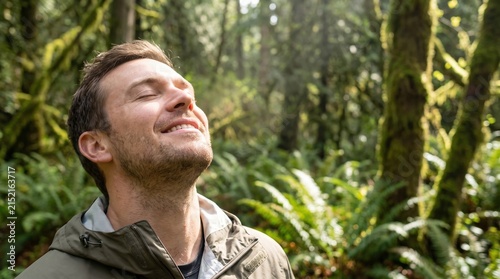 Man Enjoying Fresh Air in Lush Green Forest with Sunlight Filtering Through Trees