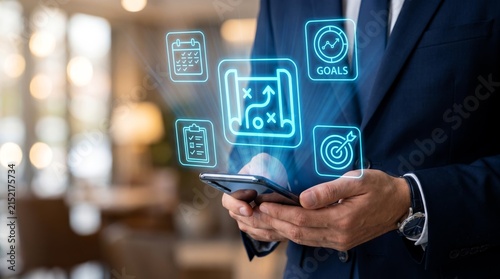 Professional businessman holding smartphone displays floating neon icons representing strategic business planning and corporate goal achievement for modern commercial project management