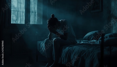 Anxious Man Sitting Alone on Bed at Night, Depressed Mood, Emotional Distress, Stress, Loneliness and Mental Health Struggle Concept
