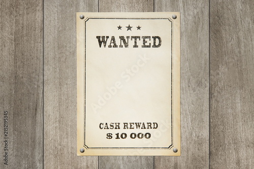 wanted poster nailed to a wooden surface