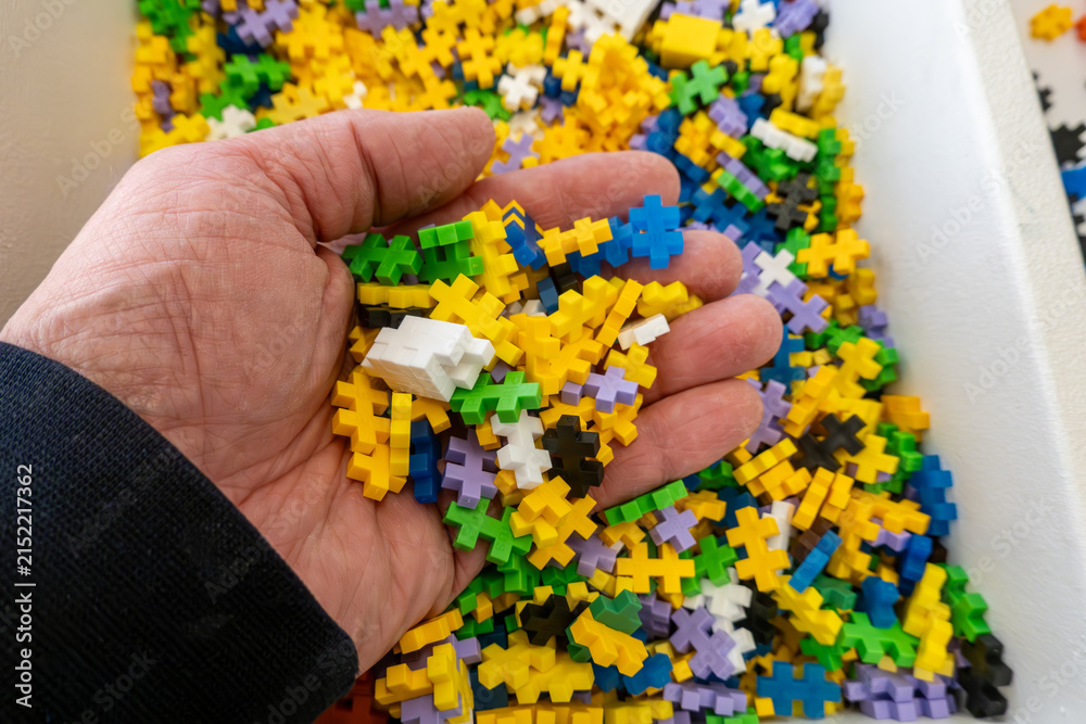 Fototapeta premium Hjorring, Denmark A handful of miniature Legos in a box.