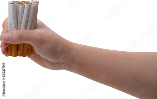 A hand is tightly gripping a handful of cigarettes with white filters and orange-yellow bodies, set against a transparent background.