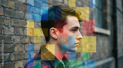 Abstract double exposure portrait of young man with digital color blocks