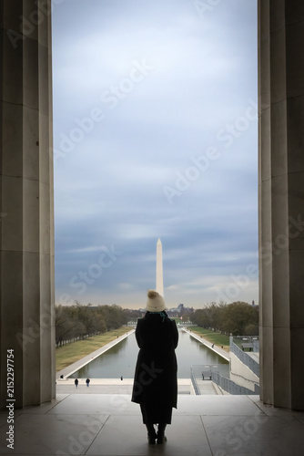 A person looking out at the Reflection pool in Washington DC