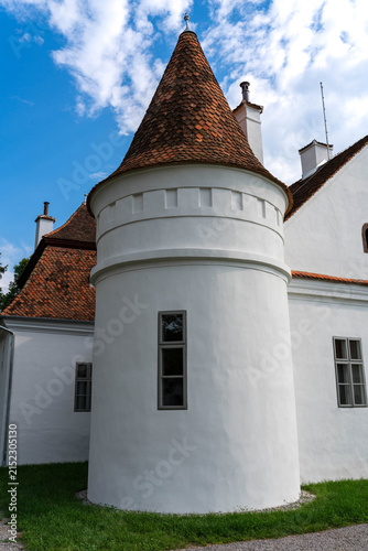  Vertical image, baroque tower on a small castle build by the nobel Daniel family in the 16 century in Transylvania, Romania.
