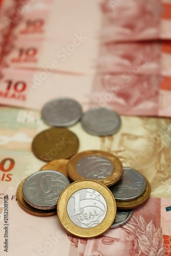 Brazilian Real banknotes and coins. Brazilian money, inflation, economy, salary, and personal finance concept.