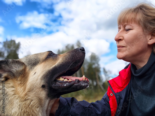 Принти на полотні Dedicated dog training session highlights bond between woman and German Shepherd