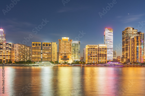 Modern urban architecture, road traffic, and Huangpu River night view in Lujiazui, Pudong, Shanghai, China