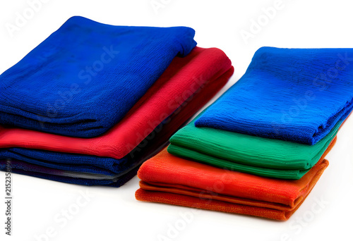 Stacks of folded colorful t...