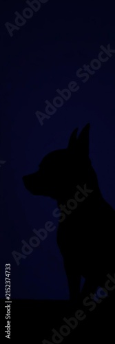 Small black chihuahua silhouette looking left, standing, dog