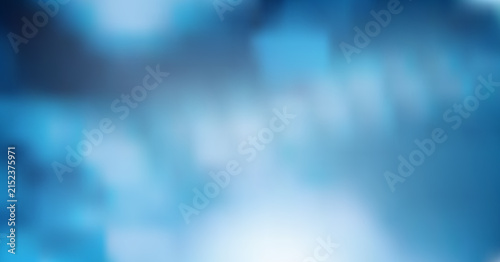 Abstract blue background with soft glowing light streaks