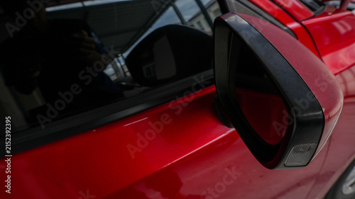 Red Car Side Mirror Close Up with Glossy Automotive Detail
